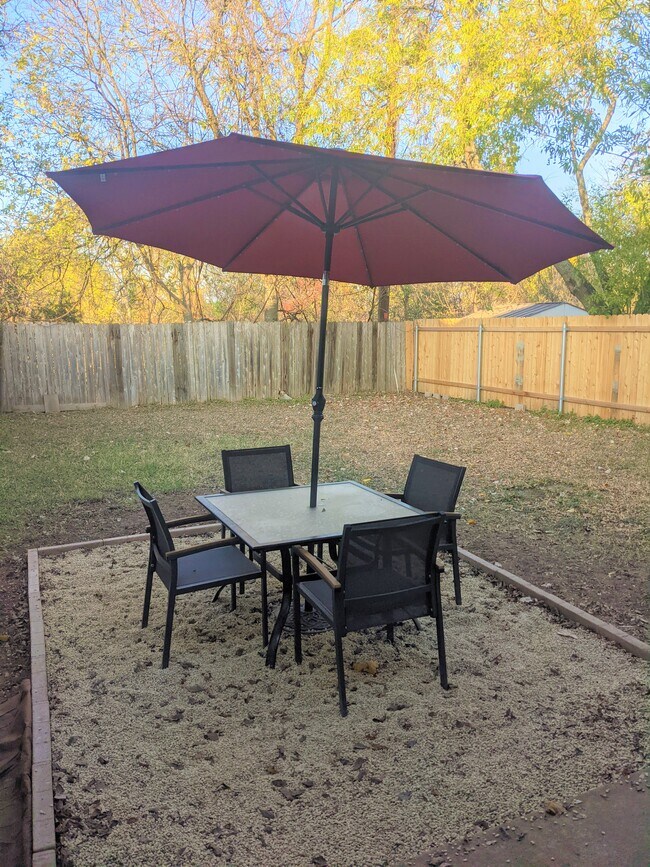 Backyard patio with fenced in yard - 13357 Water Oak Ln