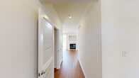 Located at 1900 Barclay Blvd in Princeton, NJ, this well-designed 2-bedroom, 2-bathroom residence offers a comfortable and functional single-floor layout. Warm hardwood flooring runs throughout the main living areas, complementing the clean, neutral palette of white walls and trim. The bright living room is a standout space, featuring a classic fireplace flanked by a built-in niche, large windows, and a sliding glass door that floods the room with natural light and offers views of the surrounding greenery. The galley-style kitchen is outfitted with rich wood cabinetry, granite countertops, a stainless steel refrigerator, dishwasher, and range, along with a window that brings in additional natural light. The generously sized primary bedroom includes a built-in closet with shelving and drawers, with direct access to a private bathroom. The second bedroom is bright and well-proportioned with its own closet access. Two full bathrooms serve the residence, one featuring a tiled tub-shower combination. Multiple hallways connect the spaces efficiently. A private attached garage with an automatic opener provides secure parking and additional storage. The overall ambiance is clean, bright, and move-in ready.