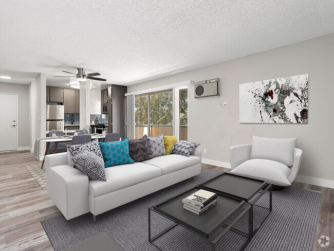 Hardwood floored living room with view of dining area, kitchen, and balcony. - Olive View Gardens