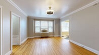Located in Denver's Capitol Hill neighborhood, this well-maintained 1-bedroom, 1-bathroom residence exudes classic charm with thoughtful details throughout. Warm hardwood floors flow through the living room, bedroom, and hallway, complemented by neutral-toned walls that create a bright and welcoming atmosphere.

The spacious living room features elegant crown molding, a decorative ceiling light fixture, and large windows with blinds that invite abundant natural light. A cast-iron radiator adds a period-appropriate touch. The generously sized primary bedroom includes a ceiling fan, a window overlooking greenery, and access to a dedicated closet.

The kitchen is well-equipped with light maple cabinetry, dark granite countertops, stainless steel appliances including a gas range and refrigerator, and a classic black-and-white checkered tile floor that adds retro character. The layout offers ample storage and counter space for everyday cooking.

The bathroom continues the vintage aesthetic with white subway tile walling, a classic hexagonal mosaic tile floor, a full bathtub, and a window for natural ventilation. A hallway connects all rooms efficiently, completing this cohesive and functional single-floor layout ideal for comfortable city living in Denver.