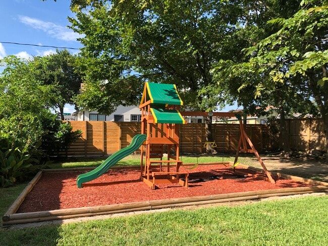 Large yard with playground and picnic area - 408 N 67th St