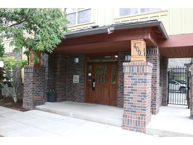 Front entrance with secure keypad entry. - 400 NE 100th Ave