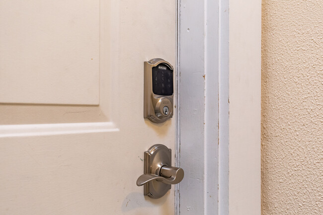 Code entry door with unique code provided to the guest during their stay. - 703 Q Ave Apt 4