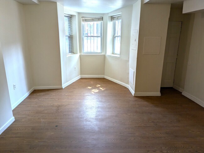 Open living/dining space with bay windows - 1912 9th St NW