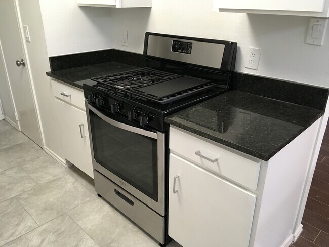 NEW gas range - 8604 Willowick Drive