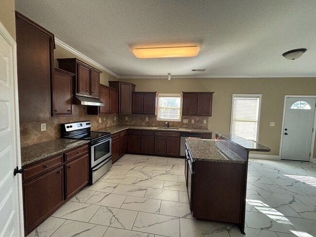 Building Photo - This property blends ample living space and storage with functional amenities.