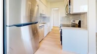 Located at 1655 Haro St in Vancouver's desirable West End neighbourhood, this one-bedroom, one-bathroom unit offers a well-designed, efficiently laid-out living space across a single floor. Light hardwood flooring runs throughout, lending warmth and continuity to every room.

The galley-style kitchen is thoughtfully appointed with white cabinetry, grey subway tile backsplash, light stone countertops, and a full suite of stainless steel appliances including a refrigerator, dishwasher, microwave, and electric range — providing a clean, functional cooking environment.

The open living area is bright and airy, benefiting from large windows and a sliding glass door that opens to a balcony, inviting natural light and outdoor views into the space. The neutral white walls and light flooring enhance the sense of openness.

The bedroom is a comfortable size, featuring a window with natural light, a baseboard heater, and a built-in mirrored sliding-door closet that adds both storage and visual depth to the room.

The bathroom is finished in a clean, minimal style with white fixtures, a white vanity with storage, and consistent light flooring. Overall, the unit presents a bright, modern aesthetic well-suited to comfortable urban living in Vancouver.