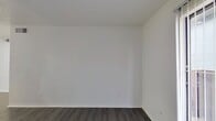 This apartment, located at 3800 S Tyler St in Dallas, TX, offers a efficient living space of 490 square feet. The single-story layout includes two bedrooms, one bathroom, a living room, and a closet. The primary bedroom is generously sized at 120 square feet, providing ample space for rest and relaxation.

Throughout the apartment, modern gray wood-look flooring creates a cohesive and contemporary aesthetic. The living area showcases an open-concept design, with a white entry door and crisp, white walls that enhance the sense of spaciousness. Natural light filters through windows, brightening the interior.

The kitchen area features white cabinetry and is partially open to the living space, promoting a fluid layout ideal for entertaining. The bathroom is equipped with essential fixtures, including a shower/tub combination with white tiling.

This apartment combines functionality with style, offering a compact yet comfortable living environment. Its location in Dallas provides urban convenience, making it an attractive option for those seeking a modern city dwelling.