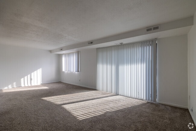 3BR, 2BA - 1,510SF - Living Room - Carlyle Tower Apartments - Southfield, MI