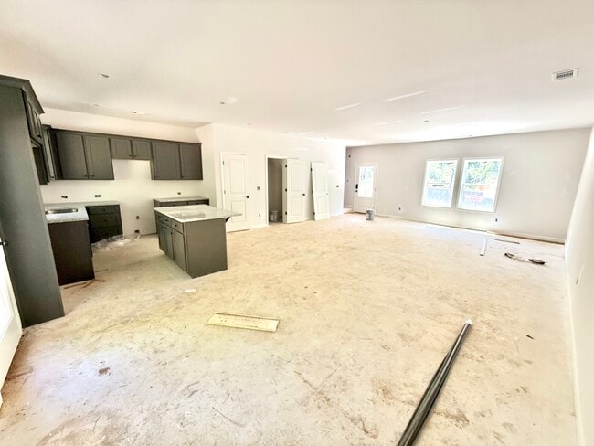 View of first floor. Open concept kitchen, dining room and living room. - Stephens Court Townhomes
