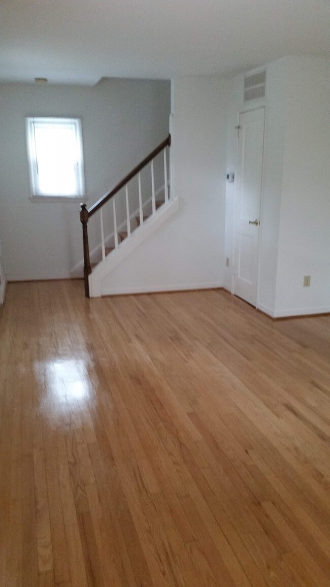Livingroom with closet & stairs - 1014 E West Hwy