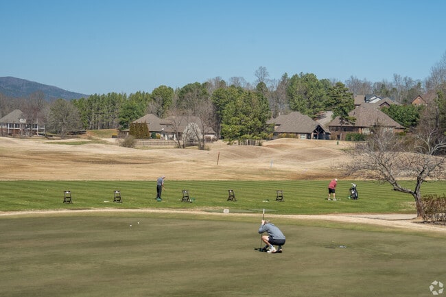 Line up a put while enjoying mountain views at Cider Ridge Golf Club in Oxford.