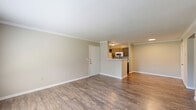 Located at 333 Normandy St in Houston, TX, this well-appointed two-bedroom, one-bathroom home offers a comfortable and functional single-story layout. The open-concept living room is a welcoming focal point, featuring rich hardwood-style flooring, crown molding, and multiple windows that fill the space with natural light and offer views of the outdoors. A convenient pass-through counter connects the living area to the galley-style kitchen, which is equipped with gray cabinetry, a double-basin sink, white appliances including a range and refrigerator, and matching hardwood-style floors that carry through from the main living area.

The generously sized primary bedroom is a standout feature, offering plush carpeting, a ceiling fan, and dual windows that invite in abundant natural light. It provides direct access to a closet and the shared bathroom. The second bedroom also features soft carpeting, a ceiling fan, and a bright window, making it well-suited as a guest room or home office. Both bedrooms are connected via hallways that contribute to an efficient and intuitive floor plan.

The bathroom is clean and functional, featuring wood-style tile flooring, gray vanity cabinetry with a marble-look countertop, a large mirror, and a full tub-shower combination. The overall aesthetic throughout the home is neutral and modern, with warm tones and consistent finishes creating a cohesive, move-in-ready feel.
