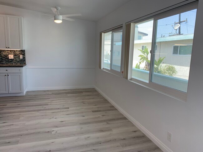 Open concept flows into large dining area w/ huge windows over walk street - 320 11th St