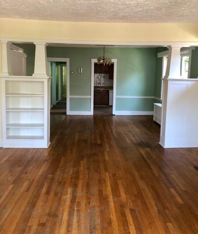Living, dining room, kitchen and hallway to bedrooms - 211 East End Ave