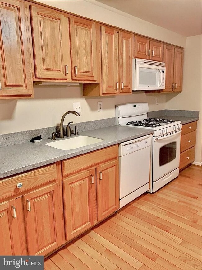Photo - Welcome to this beautifully maintained brick end residence in the heart of Falls Church, where co... Townhome