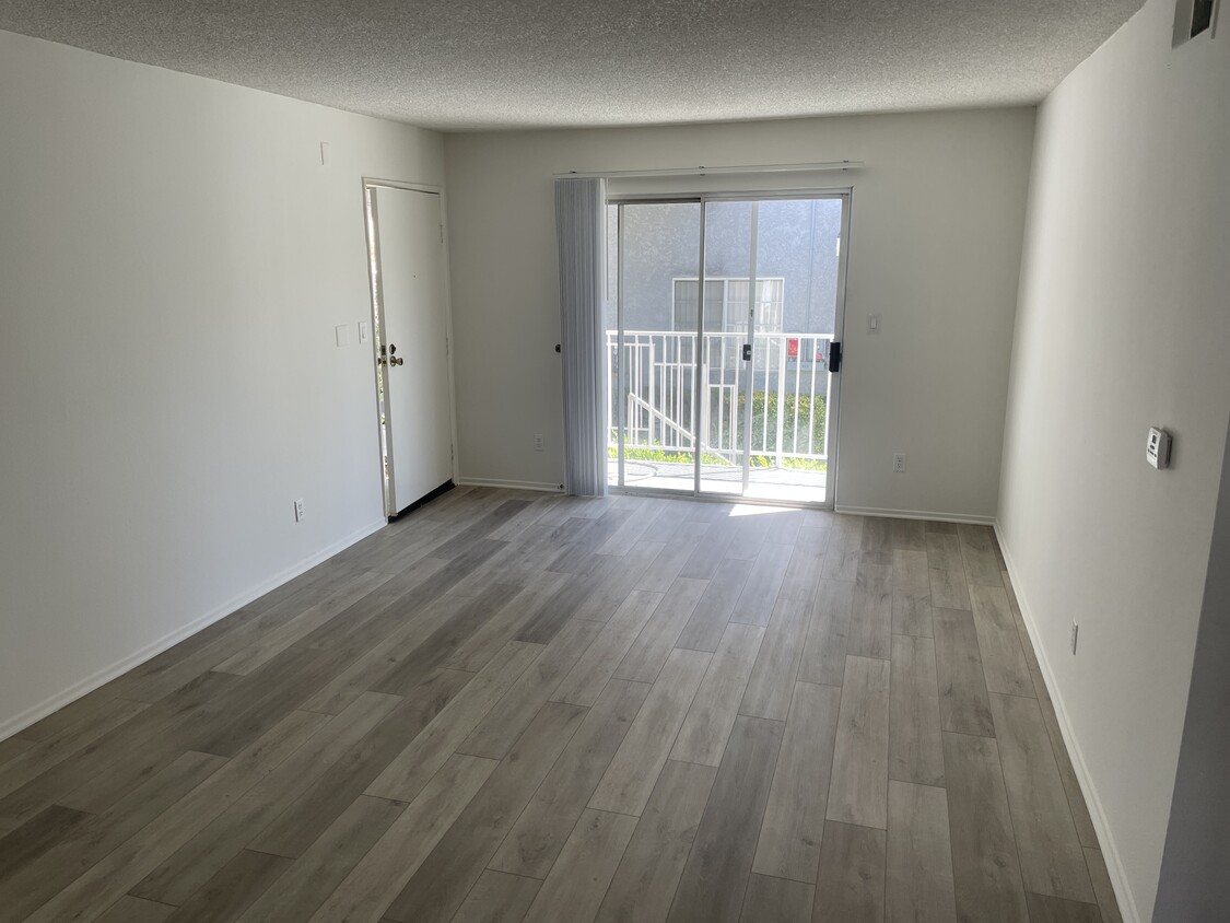 Living room with New Luxury Vinyl plank flooring - 18071 Beneda Ln