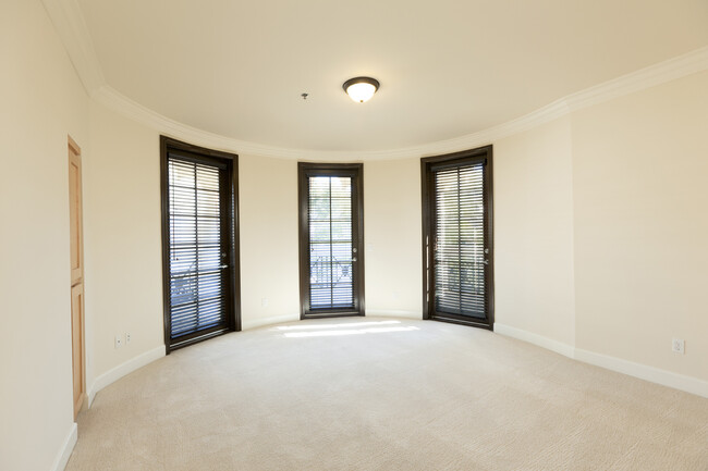 Primary bedroom with unique round wall and 3 doors to second balcony - 4443 Moorpark Way