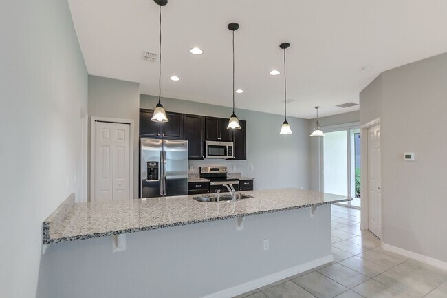 Building Photo - 3 Bedroom 2 Bath Villa in Oak Tree Pointe ...