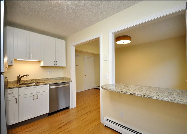 Kitchen open to dining - 1700 Farmington Ave