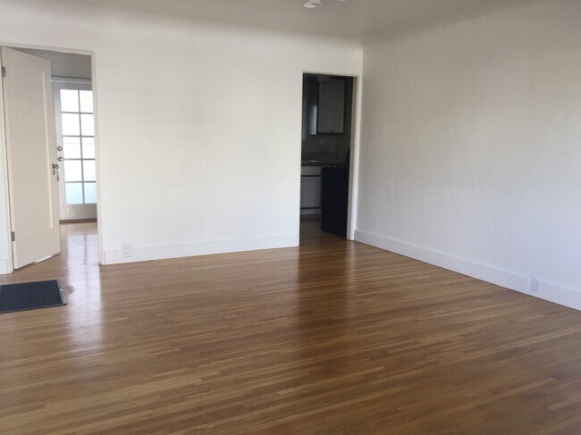 Living room with a view of the kitchen and bedroom - 3108 Broadway