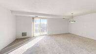 This well-designed apartment in Akron, Ohio offers 1120 square feet of living space on a single floor. The layout includes three bedrooms, three bathrooms, a kitchen, hallway, and closet space. The primary bedroom is notably spacious at 220 square feet.

The kitchen is a highlight, featuring warm wood cabinetry, granite countertops, and a mix of white and stainless steel appliances. Light-colored laminate flooring in the kitchen area contrasts nicely with the carpeted bedrooms, creating distinct living zones.

Bedrooms are generously sized, with large windows allowing ample natural light. The bathrooms are modern and functional, with one featuring wood-look flooring, a white vanity, and a glass-enclosed shower.

Throughout the apartment, neutral wall colors and carpeting create a bright, airy atmosphere. The living area is particularly spacious, with sliding glass doors leading to an outdoor space and offering scenic views.

This apartment combines comfort and practicality, with its updated fixtures, modern design elements, and efficient use of space. Its location at 80 N Portage Path puts residents in the heart of Akron, making it an ideal choice for those seeking a contemporary urban living experience.
