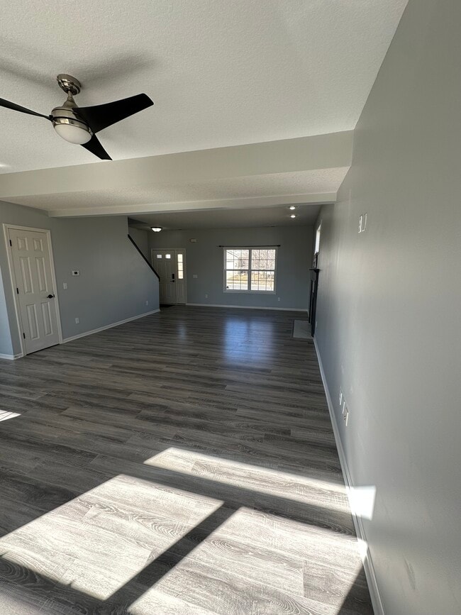 Living Room + Fire Place + Front Entrance - 411 Treeline Cv