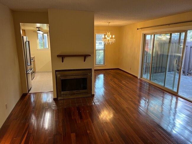 Dining room, kitchen, and fireplace/mantel. - 233 Red Oak Dr E