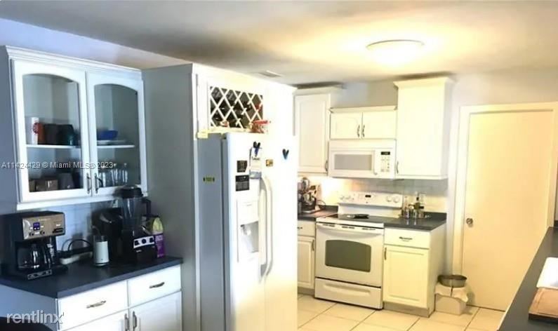Foto principal - 4 br, 2 bath House - 9401 NW 20th St