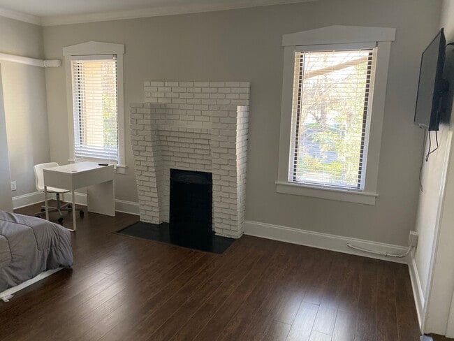 Work table and Fireplace - The Residence at 1743 N Decatur Apartments