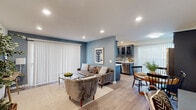 Located at 333 W Queen St in Inglewood, CA, this single-floor residence offers a thoughtfully designed open-concept layout that seamlessly connects the living, dining, and kitchen areas. The living room features cool blue-gray accent walls, recessed lighting, and large vertical-blind-covered windows that allow ample natural light to fill the space, complemented by smooth hardwood-style flooring throughout.

The kitchen is well-appointed with slate-blue cabinetry featuring glass-front upper doors, a mosaic tile backsplash, light stone countertops, a stainless steel sink, and a stainless steel dishwasher. The adjacent dining area provides an intimate setting with natural light from nearby windows.

The primary bedroom features a ceiling fan, neutral tones accented by a blue-gray feature wall, and direct access to natural light. The second bedroom includes a ceiling fan, mirrored sliding closet doors, a wall-mounted mini-split unit, and private exterior access through a windowed door.

The bathroom is finished with large-format stone-look tiles, a soaking tub, and a sleek frameless glass sliding shower enclosure with decorative mosaic tile accents, offering a clean and modern aesthetic throughout.