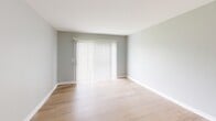 Located at 2044 Georgian Way in Lexington, Kentucky, this one-bedroom, one-bathroom residence offers a thoughtfully arranged single-floor layout with a clean, contemporary aesthetic throughout. Light wood-look flooring runs seamlessly across the living room, bedroom, and hallways, complementing the soft gray wall tones and crisp white trim that define the interior palette.

The living room serves as the heart of the home, featuring a large sliding door dressed with vertical blinds that allows natural light to filter in and provides access to the outdoors. The space is open and well-proportioned, offering a comfortable area for everyday living.

The kitchen stands out with its updated finishes, including white shaker-style cabinetry with matte black hardware, marble-look countertops, a classic white subway tile backsplash, a deep single-basin sink with a black gooseneck faucet, and stainless steel appliances. The layout is efficient and functional, connecting seamlessly to the hallway.

The bedroom is generously sized, featuring a spacious built-in closet with sliding doors and direct hallway access, offering practical storage and a comfortable retreat.

The bathroom is finished in a clean all-white palette with a full tub-shower combination, white tile surround, and oil-rubbed bronze fixtures, contributing a timeless and polished look throughout.