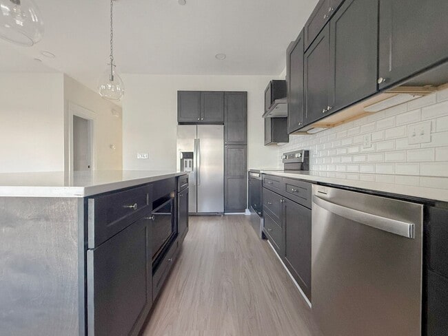 Building Photo - Spacious 4-Bedroom Townhome at Highbury + Summer Special