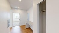 Located at 1510 Valentia St in Denver's 80220 neighborhood, this single-floor, 3-bedroom, 2-bathroom residence offers a clean, modern layout with thoughtful finishes throughout. The open kitchen and living area features light hardwood-style flooring, grey cabinetry extending to the ceiling, granite countertops, and white appliances including a range, microwave, and dishwasher — all complemented by recessed lighting. The living area is generously sized with dual windows that invite abundant natural light and outdoor views. Each bedroom is well-proportioned; the primary bedroom offers a comfortable sense of space, while the secondary bedrooms feature plush carpeting and windows with exterior greenery views. A built-in granite-topped desk nook and hallway closet add practical storage options. The two bathrooms are consistently appointed with granite vanity countertops, grey cabinetry, wood-style flooring, and full tub-shower combinations with curved curtain rods. A spacious walk-in closet with dual hanging rods provides ample storage. The unit's clean white walls, consistent finishes, and natural light create a bright, functional living environment throughout.