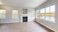 Step into a world of endless possibilities in this exquisite Boise residence. The heart of the home is a bright, open-concept kitchen and living area, where culinary dreams come to life amidst sleek white cabinetry, subway tile backsplash, and stainless steel appliances. The spacious living room, adorned with a cozy fireplace and large windows, invites you to relax and entertain in style.

Retreat to the luxurious primary bedroom, a generous 170 sq ft sanctuary bathed in natural light. With three impeccably designed bathrooms, including spa-like fixtures and warm wood-look flooring, every day feels like a vacation. The second bedroom offers versatility as a guest room, home office, or personal haven.

Throughout the home, gleaming hardwood floors and plush carpeting create a harmonious blend of elegance and comfort. Ample closet space ensures clutter-free living, while the outdoor balcony beckons you to enjoy Boise's beautiful scenery.

Located in the desirable River Quarry neighborhood, this home places you at the center of Boise's vibrant culture and outdoor recreation. Whether you're a first-time buyer or looking to upgrade your lifestyle, this property offers the perfect canvas to paint your dreams. Don't miss the opportunity to make this house your forever home – where every day feels like an adventure in luxury living.