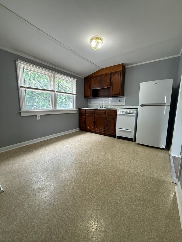 Kitchen with appliances, new sink and room for a table - 29 W 7th St