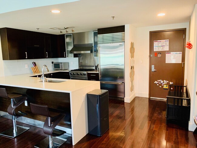 Kitchen with bar style dining - 601 Observer Hwy