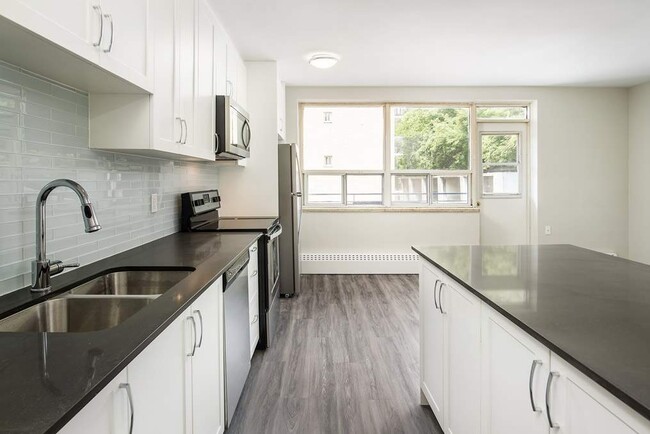 Building Photo - 2893-2897 St Clair Av E