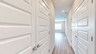 Located at 3030 Ascend Oak St in Apopka, FL, this single-story, 3-bedroom, 2-bathroom home presents a clean, contemporary design throughout. The layout flows efficiently across one level, connected by well-lit hallways featuring crisp white panel doors with polished chrome hardware and durable wood-style flooring.

The kitchen is a standout space, boasting white shaker cabinetry, a white subway tile backsplash, quartz-style countertops, stainless steel appliances, and a center island with pendant lighting—ideal for both everyday cooking and entertaining.

The living area features light wood-style flooring and neutral-toned walls, with access to natural light through windows fitted with horizontal blinds. The three bedrooms offer plush carpet flooring and soft, warm wall tones, with the secondary bedrooms providing ample natural light through large windows with outdoor views.

The primary bathroom impresses with a dual-sink vanity, white shaker cabinets, brushed nickel hardware, and framed mirrors above a long quartz-style countertop. The secondary bathroom includes a full tub-shower combo, a single-sink vanity, and matching finishes. Throughout the home, a consistent neutral palette and modern fixtures create a bright, inviting, and move-in-ready atmosphere.