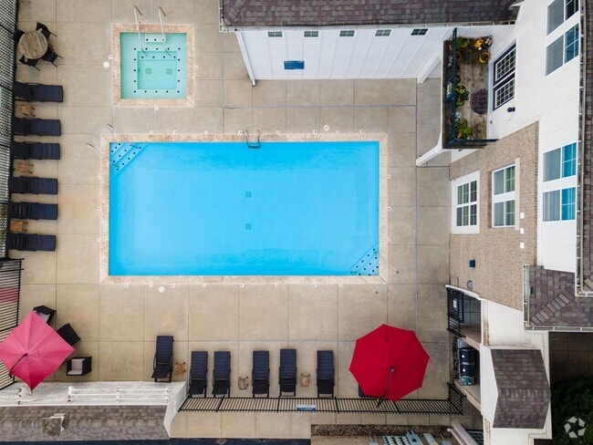 Sparkling Pool with Sundeck, Hot Tub, and Grilling Area - The Fort Apartments