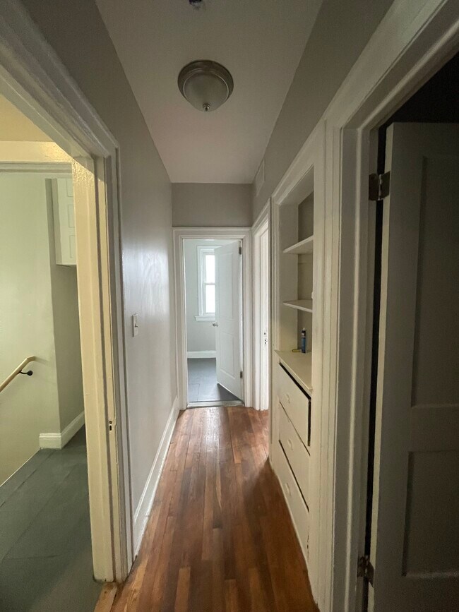 Hallway, with original linen closet. - 2241 W Euclid St