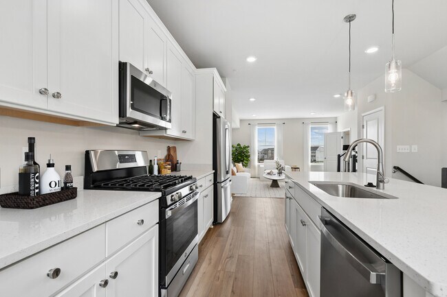 Enjoy plenty of room to prep, cook, and gather in this open-concept space. - Everstone at Cedar Hill
