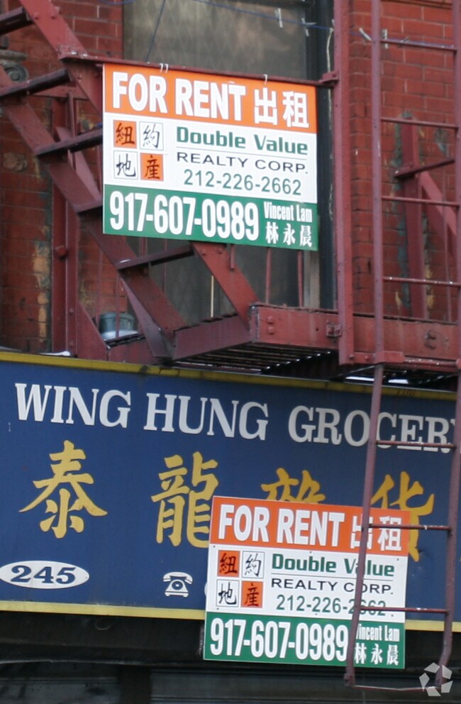 sign - 245 Broome St