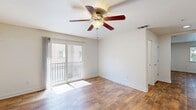 Located at 2500 Chalmette Ct in Rocklin, CA, this three-bedroom, four-bathroom multi-story home offers a thoughtfully designed layout spread across three floors. The garage level provides convenient enclosed parking with an automatic opener and utility access. The main living floor features warm hardwood flooring throughout, a bright living room with a ceiling fan and sliding glass door opening to a private balcony, and a well-equipped kitchen. The kitchen showcases rich honey-toned cabinetry, dark granite countertops, a central island, and a full suite of stainless steel appliances, including a gas range, dishwasher, and refrigerator. The upper floor hosts the bedrooms, including a generously sized primary suite with soaring ceilings, an arched accent window, a ceiling fan, and a sliding glass door leading to a balcony. The carpeted secondary bedrooms are bright and well-proportioned. The bathrooms are finished with dark granite vanity tops, warm wood cabinetry, and hardwood floors, with arched windows adding architectural character. Neutral tones and abundant natural light create a clean, inviting ambiance throughout the home.