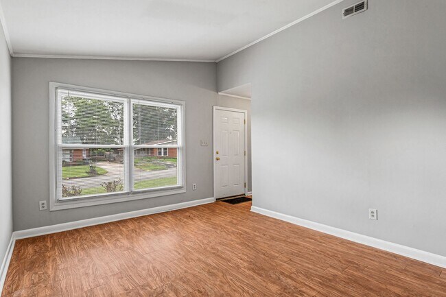 Building Photo - NE – Desirable Neighborhood, Brick Home, Wood/Laminate Flooring, Vaulted Ceilings, Carport, Fenced!