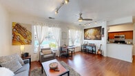 Located at 6730 4th Ave in Sacramento, CA, this one-bedroom, two-bathroom residence offers a thoughtfully designed single-floor layout that maximizes every square foot. Warm hardwood flooring flows throughout the main living areas, lending a cohesive and inviting feel to the space.

The combined kitchen and living room serves as the heart of the home. The galley-style kitchen features warm wood cabinetry, dark granite-style countertops, stainless steel appliances including a refrigerator, range, microwave, and dishwasher, and a peninsula that opens toward the living area. The living room is bright and airy, with multiple windows dressed in sheer curtains that allow ample natural light, complemented by a ceiling fan with track lighting overhead.

The bedroom is a comfortable retreat with plush carpeting, a closet, a window for natural light, and direct sightlines to the kitchen. The two bathrooms provide added convenience, one featuring a full soaking tub. A dedicated hallway connects the rooms efficiently, and in-unit laundry adds everyday practicality. Clean white walls and a neutral palette throughout create a versatile, move-in-ready environment ideal for those seeking functional, comfortable living in Sacramento.