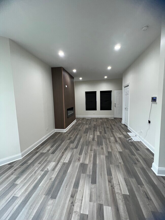 Living room w/ Fireplace - 8235 S Cornell Ave