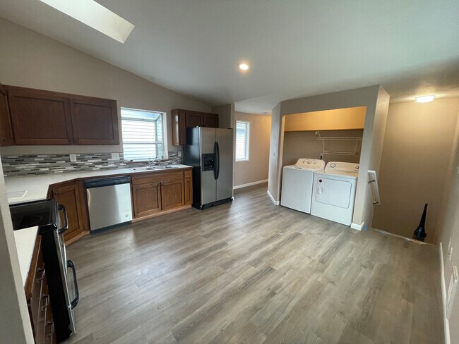 Upstairs Kitchen w/laundry - stairs to main floor/entry - 7501 27th Avenue Northeast