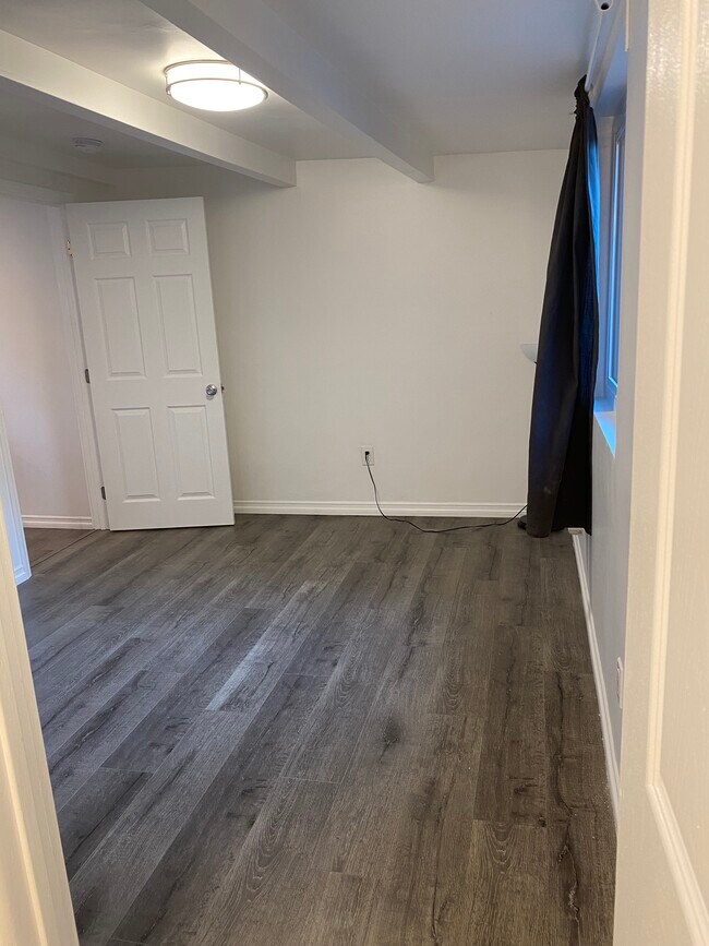 laminated distressed wood-floor throughout - 6756 Tyrone Ave