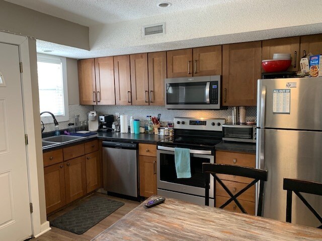 Unit 4 remodeled kitchen - 919 Indiana St
